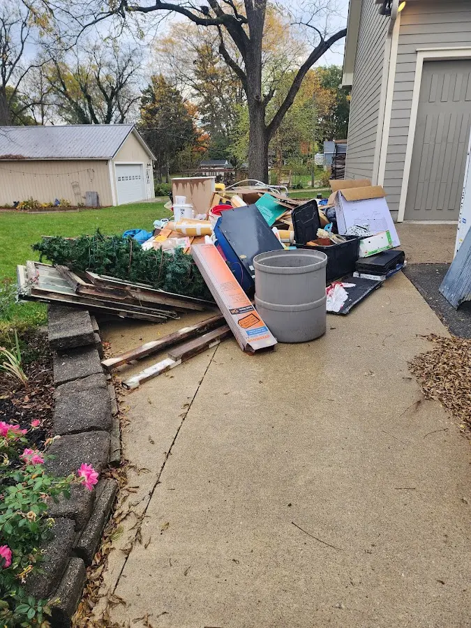 Dumpster being loaded with debris for 3 Yard Dumpster Rental in Deltona